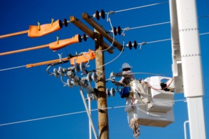 Electric utility lineman at work