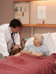 Old woman in hospital bed