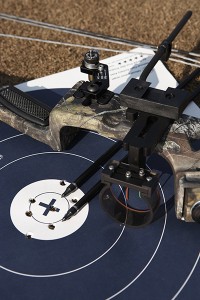 Hunting bow and arrows atop target