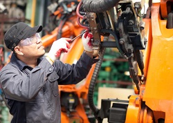 Repairman in factory