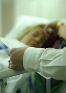 Woman laying in hospital bed