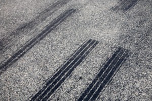 A close up of skid marks on a road.