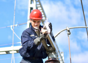 Construction Worker Working in Power Substation